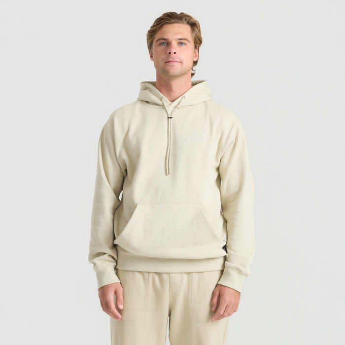 Adventurous traveler in khaki pants with hooded jacket exploring outdoors