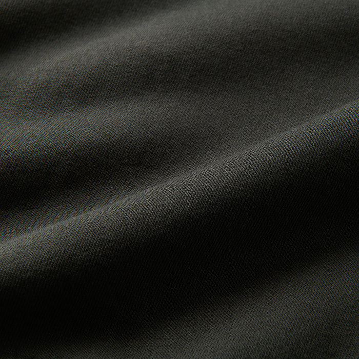 Woven grey fabric detail showcasing the texture and quality typical of Roark adventure gear.