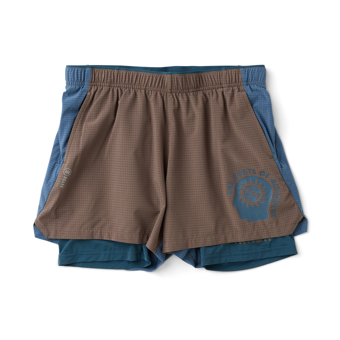 Roark active Bermuda shorts in the field, designed for adventure and outdoor activities.