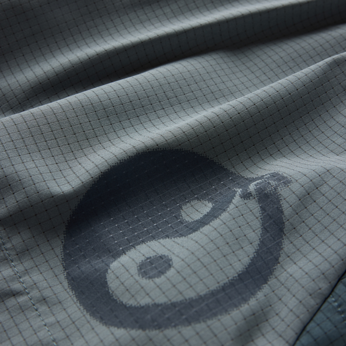 Slate Bommer 3.5" shorts fabric detail showing textured woven material with grid pattern and tonal branding in close-up view