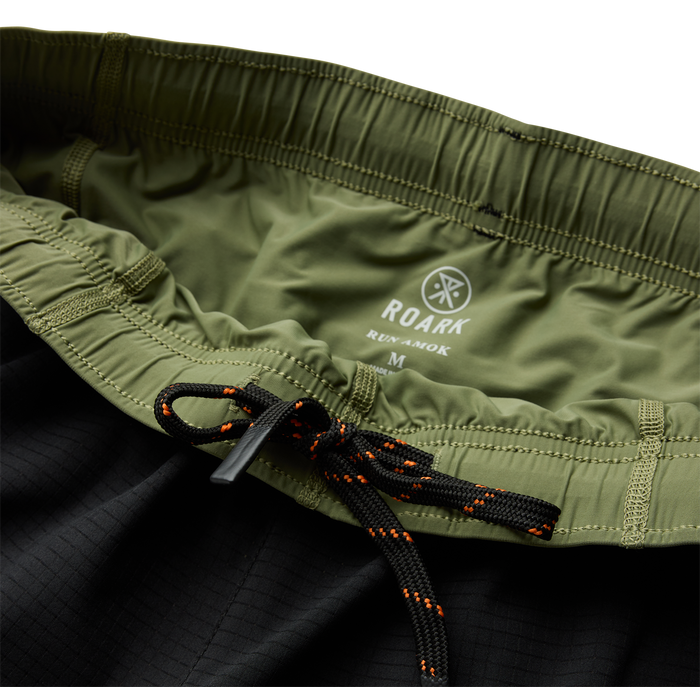 Stylish black boardshorts by Roark, perfect for adventure and outdoor activities.