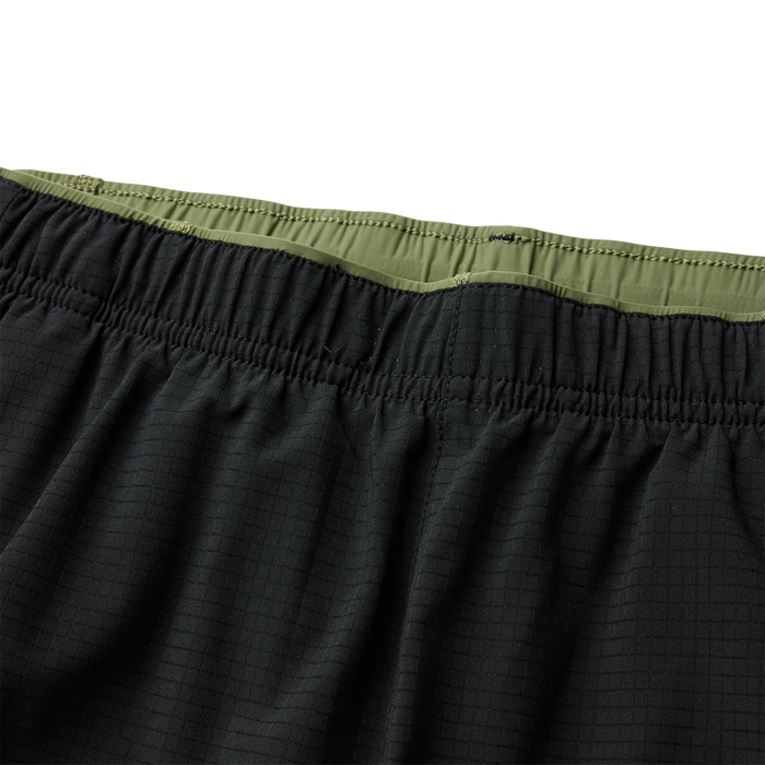 Close-up of a textured black fabric detail from Roark's adventure gear collection.