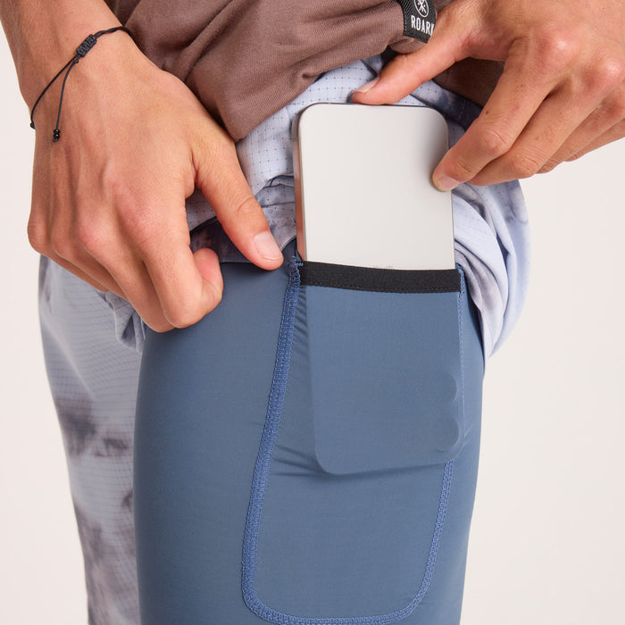 Close-up view of a person in active, adventure-ready attire featuring sweatpants and walking shoes, perfect for exploration and travel.