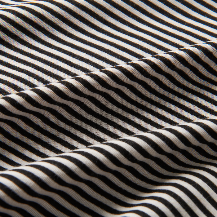 Detail shot of the Roark Borrego Short Sleeve Tee in Stripe's neckline, highlighting its classic crewneck design and comfortable fit.