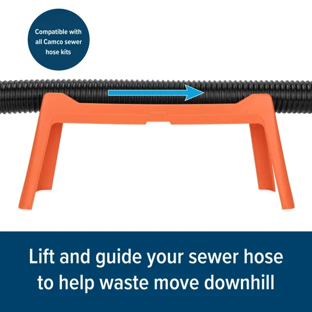Orange Camco Rhino RV Sewer Hose Support 43072 - Outdoor Lifestyle Close-Up with Hose on Uneven Ground | United RV Parts