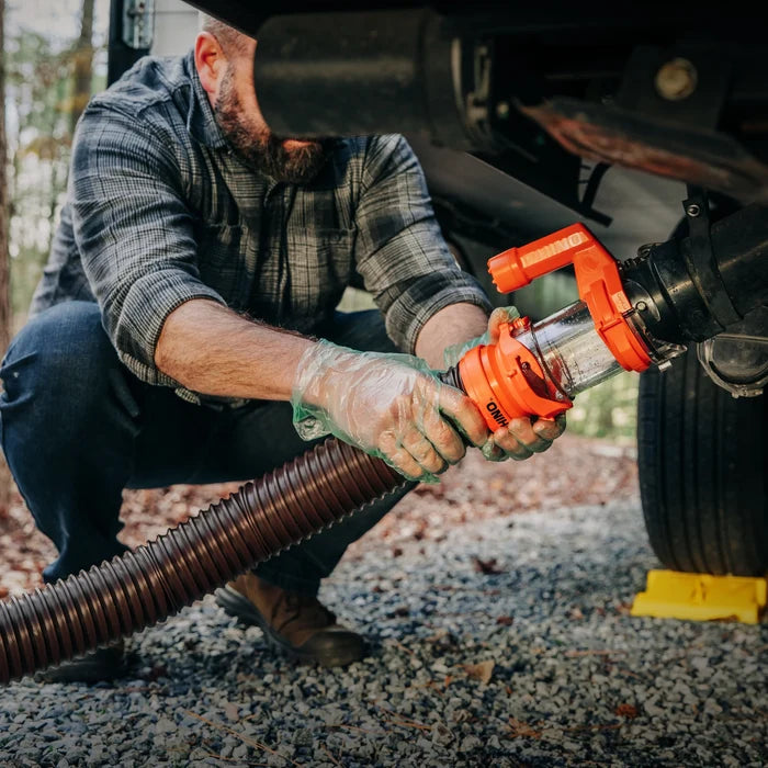RV Owner Installing Orange Rhino Sewer Hose Extension at Campground - In Use | United RV Parts