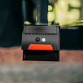 Black Camco 40332 RV Bumper Cap Solar Light with Orange Accent - Lifestyle Angle | United RV Parts