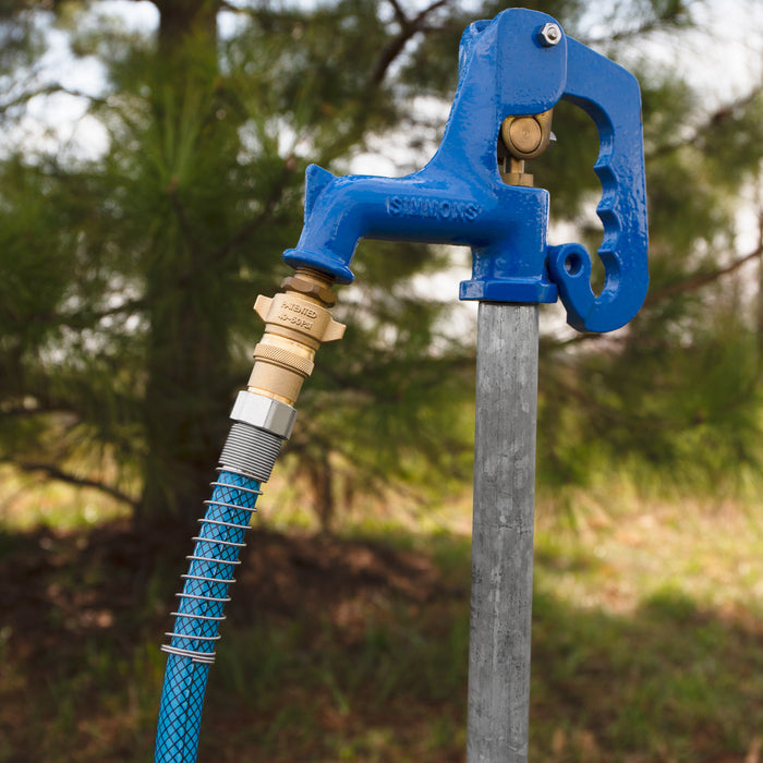 Blue Mesh Water Hose Connected to Outdoor Spigot - Lifestyle Application | United RV Parts