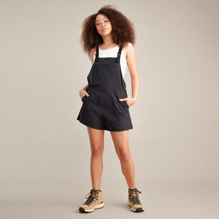 Roark Women's Canyon Romper: Front view in Black, showcasing a model wearing it.