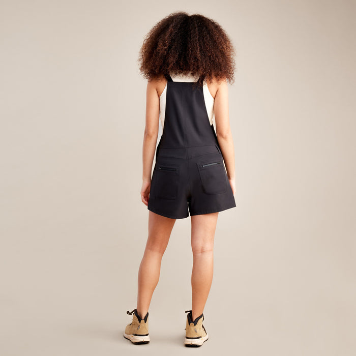 Roark Women's Canyon Romper in Black: Front view with a model wearing it.
