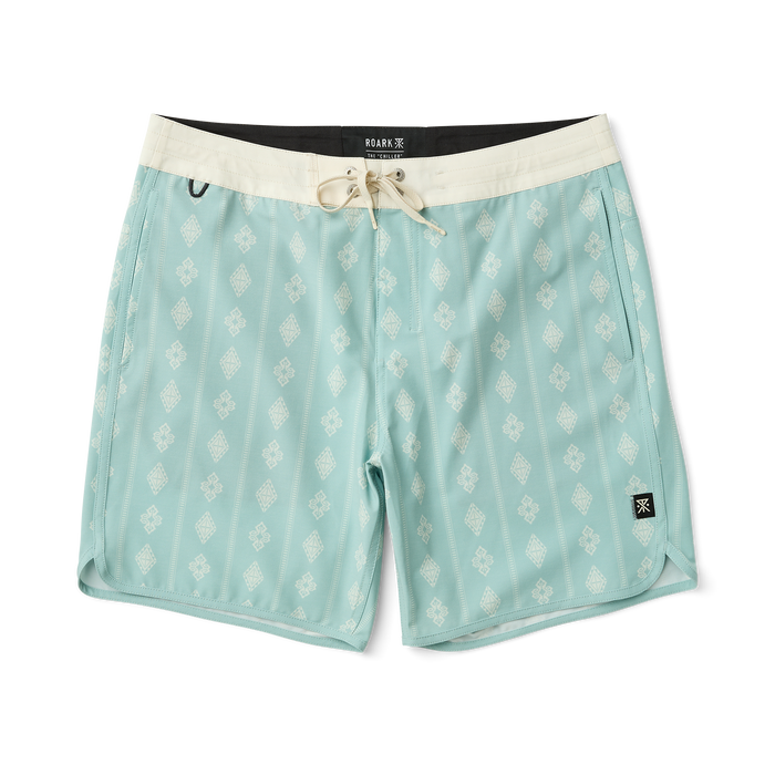 Versatile Roark boardshorts perfect for adventure and travel, displayed in a dynamic outdoor setting.