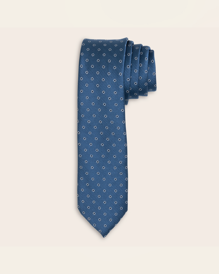 Blue tie with small white flowers