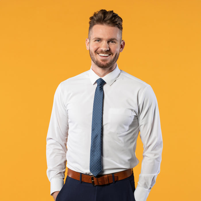 Blue tie with small white flowers on a white shirt