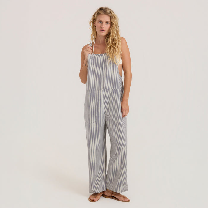 Adventure-ready Roark one-piece overall garment laid out, perfect for outdoor exploration and travel, in neutral tones.