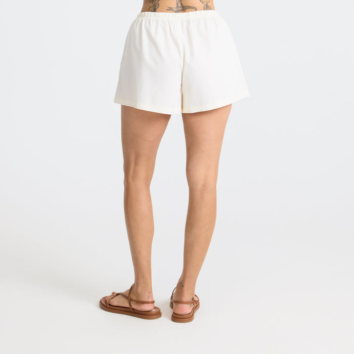 Active male adventurer wearing durable Bermuda-style Roark shorts while exploring outdoors