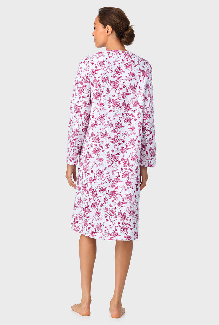 A lady wearing Crimson Floral Quilted Zip Duster