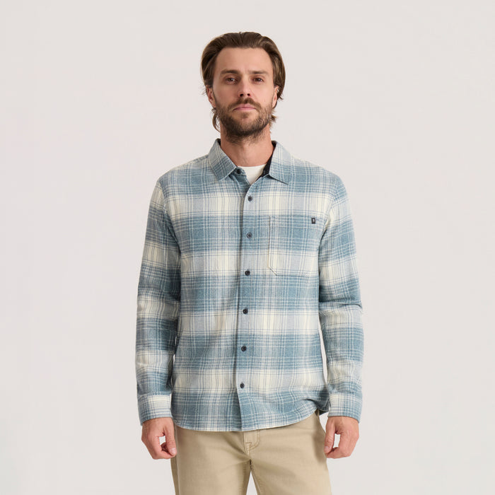 Crossroads organic cotton flannel shirt in hazy blue plaid, worn by man with chest pocket against neutral background