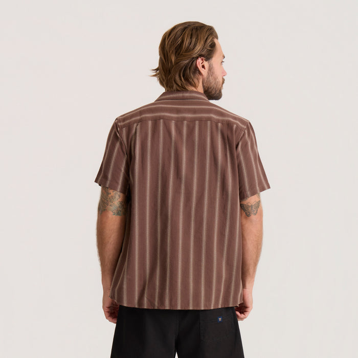 Roark Crosswinds Button Up Shirt in coco bean brown with vertical stripe pattern, worn by man shown from back view