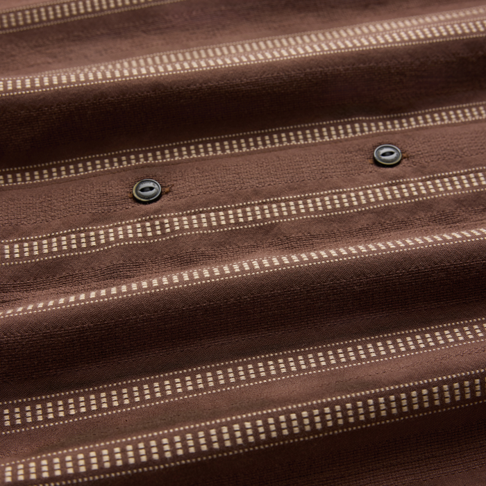 Crosswinds Button Up Shirt in coco bean brown fabric with cream striped pattern and metal buttons, close-up detail view