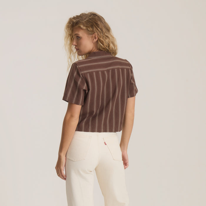 Crosswinds Camp Button Up Shirt in coco bean brown with vertical stripe pattern, worn by model with cream jeans, back view