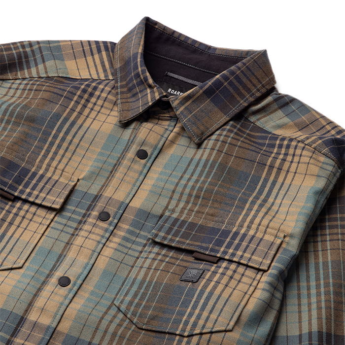 Close-up of a Roark Khaki Adventure Jacket RW452 featuring durable fabric in outdoor setting.