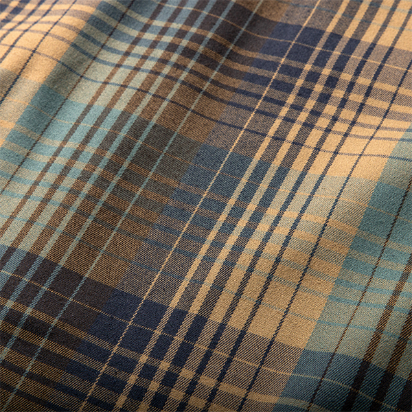 Assorted fabrics including tartan, plaid, and denim textures, capturing Roark's spirit of adventure and rugged outdoor style.