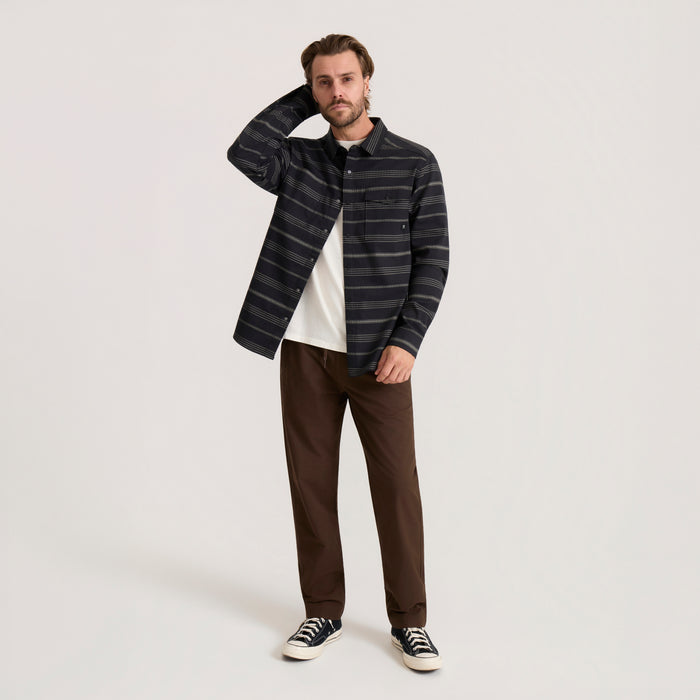 Diablo long sleeve flannel shirt in black with horizontal stripes worn by model with brown pants and sneakers
