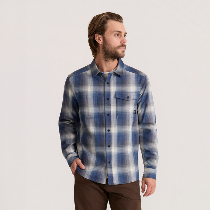 Roark Diablo long sleeve flannel in slate blue and white plaid worn by man against neutral background