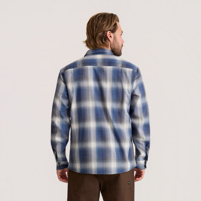 Man wearing Diablo long sleeve flannel shirt in blue and white plaid pattern, shown from back view on neutral background