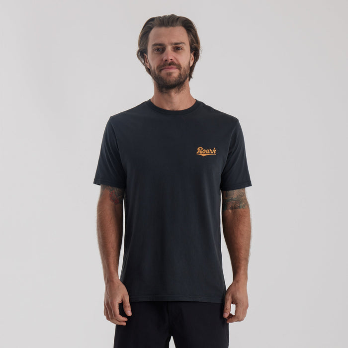 Roark Diamond Script Premium Tee in Black: Front view, showcasing a model wearing it.