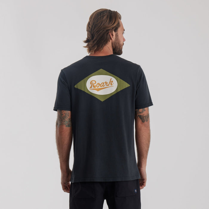 Roark Diamond Script Premium Tee in Black: Front view, showcasing a model wearing it.