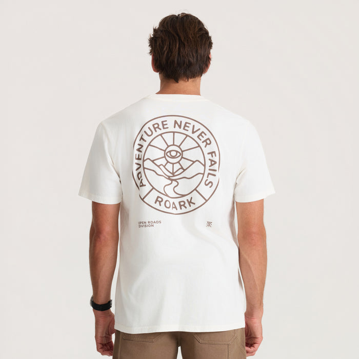 White short-sleeve t-shirt with circular back print featuring "Adventure Never Fails Roark" text and eye symbol design on male model