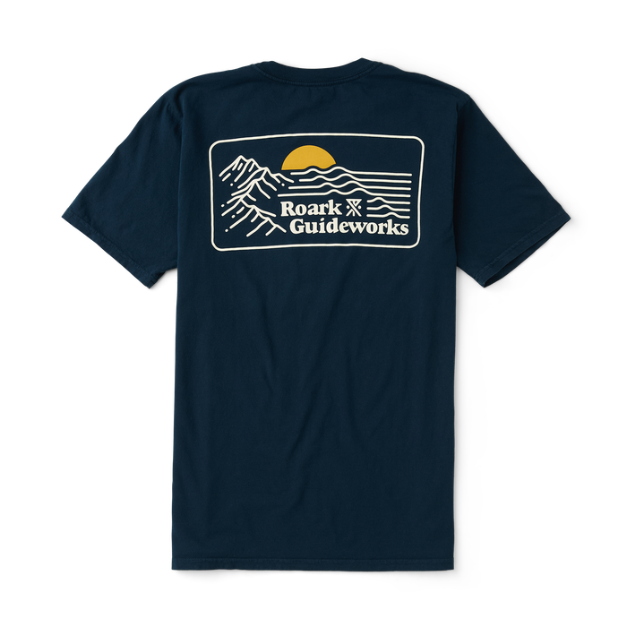 Close-up of a navy blue Roark active shirt sleeve designed for adventure and outdoor activities.