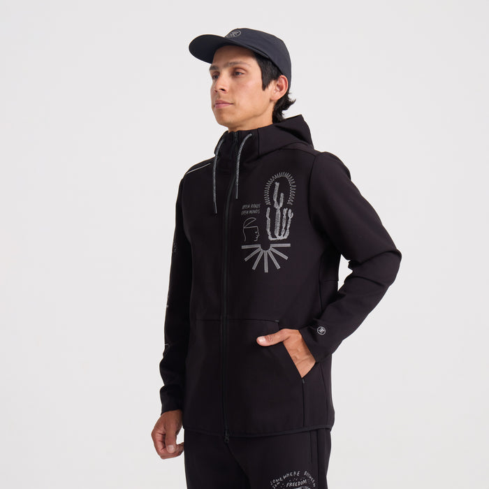 Close-up of a black polar fleece hoodie featuring a hood, zipper, and pockets, ideal for outdoor adventures and travel.