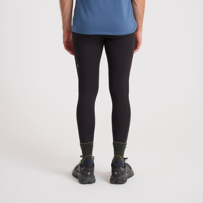 Person wearing Roark black active leggings and walking shoes on an outdoor trail, ready for adventure