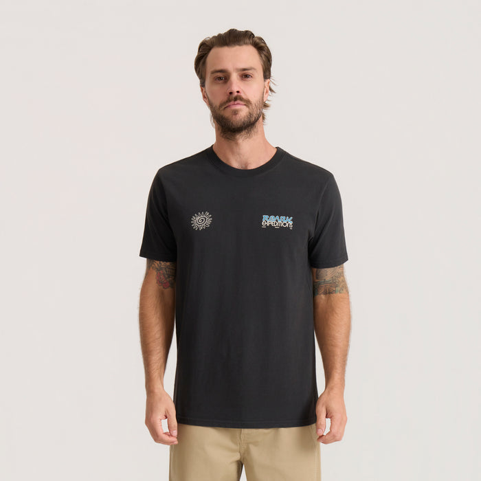 Black Elevated Research Premium Tee with sun and expedition graphic logos worn by model with tattoos and tan shorts