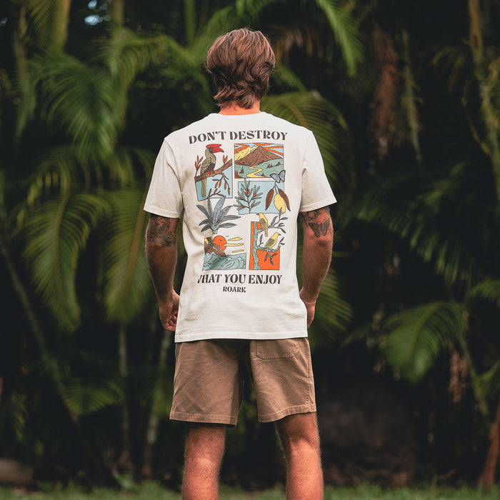 Active man wearing a premium tee paired with boardshorts by Roark, ideal for adventure and outdoor activities