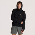 Black Evolve hoodie worn by model with hood up, paired with gray shorts on neutral background