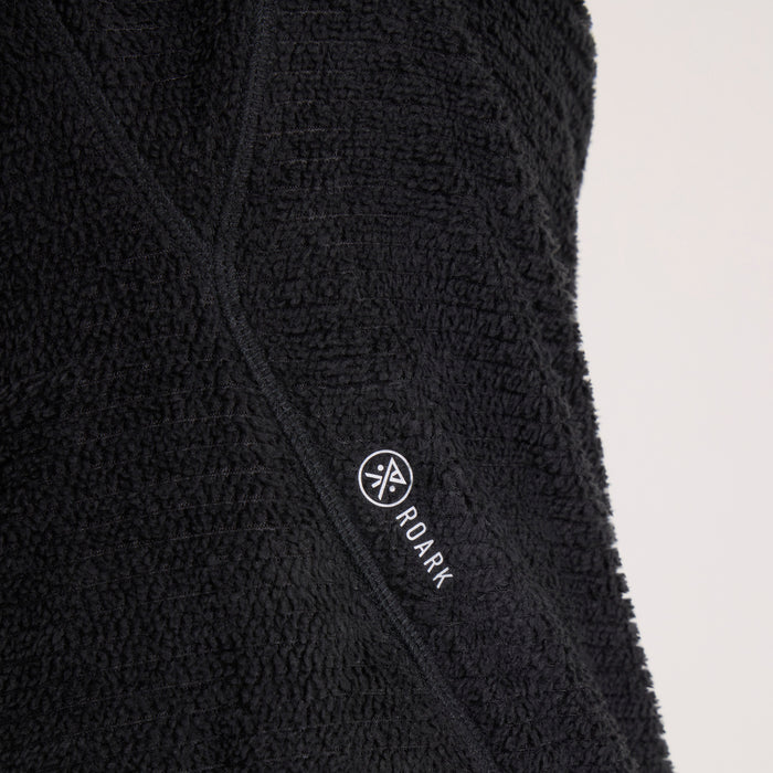 Black Roark Evolve Hoodie with embroidered brand logo visible on textured fabric, close-up detail shot