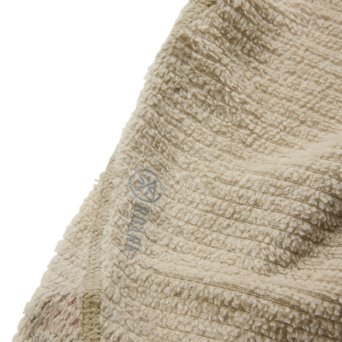 Beige textured Evolve Hoodie in sand color, close-up detail showing woven fabric pattern and brand logo label