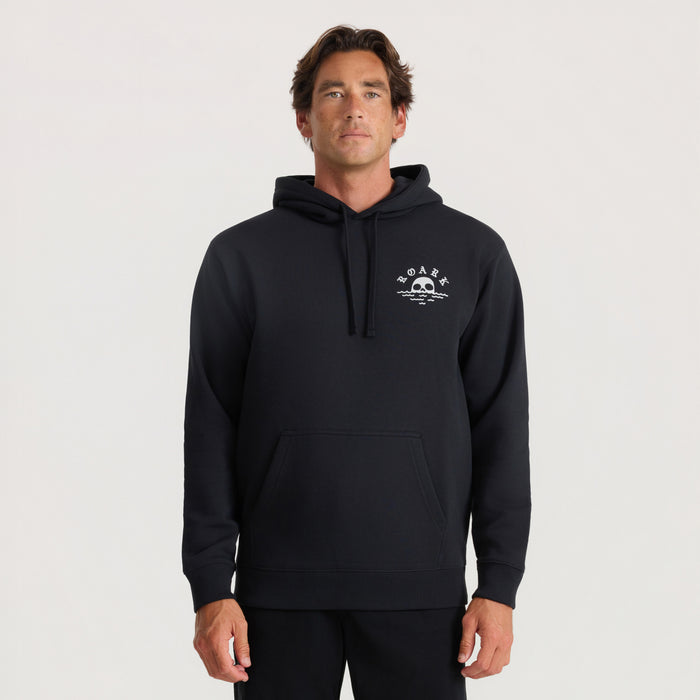 Black Roark hoodie with white skull and wave logo on chest, worn by male model against neutral background