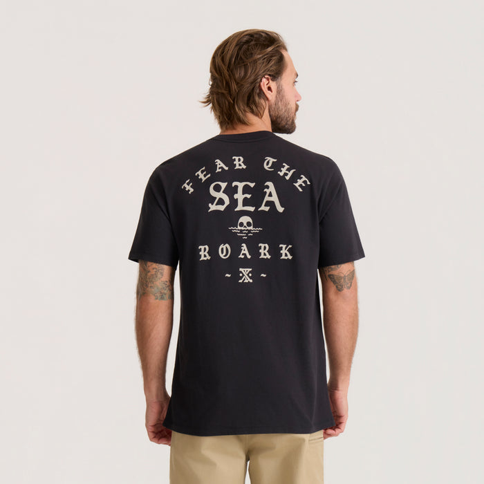 Black short-sleeve tee with cream "Hear The Sea Roark" graphic and skull design printed on back, worn by male model