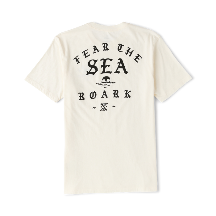 Cream colored short-sleeve t-shirt featuring black text reading "Hear The Sea Roark" with skull graphic on back view