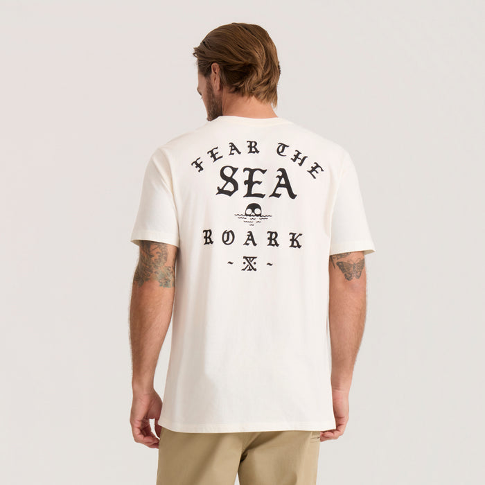 Off-white short sleeve t-shirt with black "Fear The Sea Roark" graphic print on back, worn by man from behind