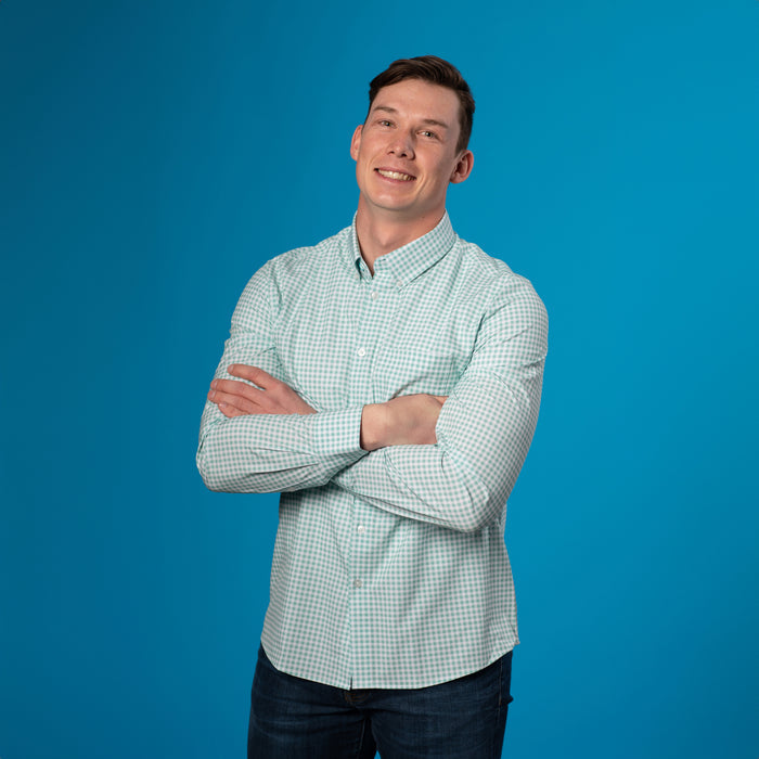 Man wearing light green and white gingham shirt