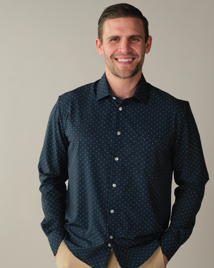 Man wearing navy shirt with white polka dots