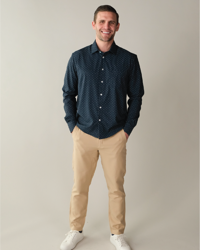 Man wearing navy shirt with white polka dots