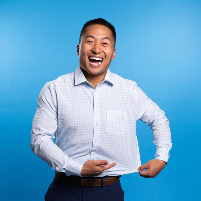Man wearing pale blue shirt with white gingham