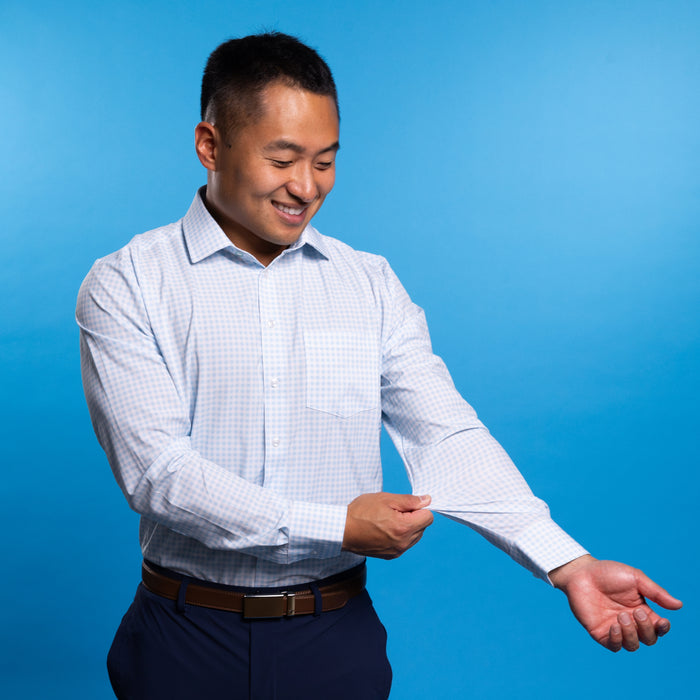 Man wearing pale blue shirt with white gingham