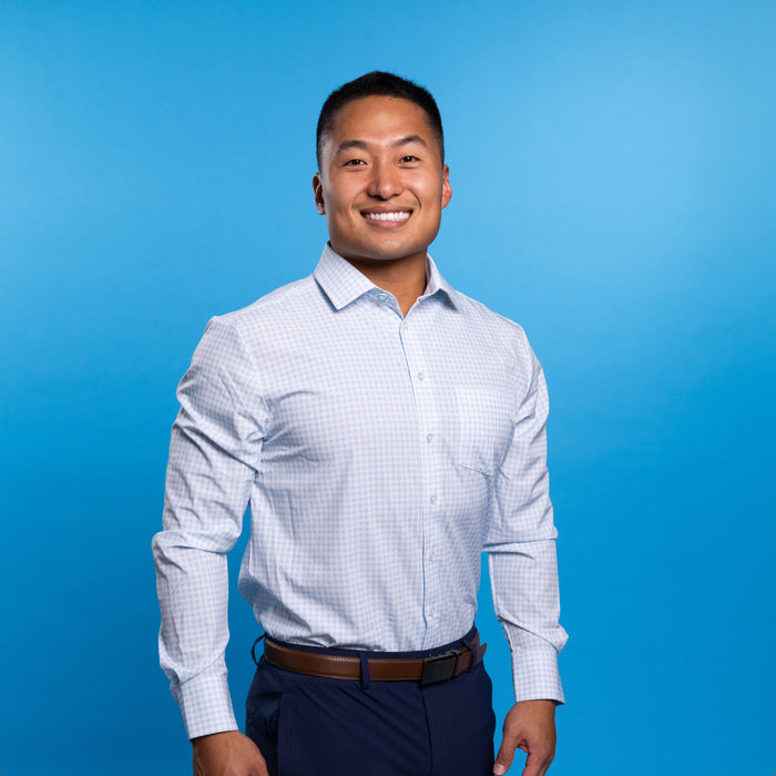 Man wearing pale blue shirt with white gingham